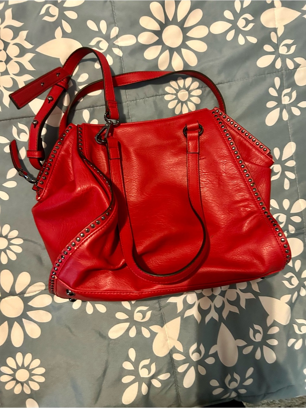 Red satchel purse with studded detail and size zips